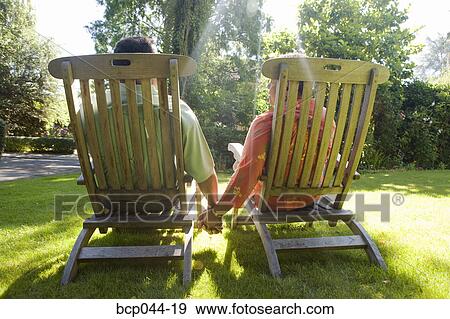 Couple holding hands outside View Large Photo Image Stock Photo - Couple holding hands outside. Fotosearch