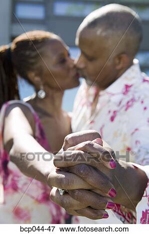 Couple kissing outdoors View Large Photo Image Stock Photo - Couple kissing outdoors. Fotosearch