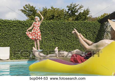 Senior couple having poolside fun View Large Photo Image Stock Image - Senior couple having poolside fun. Fotosearch