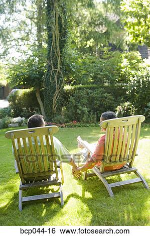 Seniors holding hands outside View Large Photo Image Stock Photograph - Seniors holding hands outside. Fotosearch