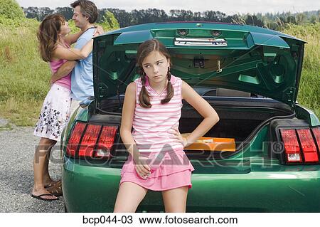Unhappy daughter of affectionate parents View Large Photo Image Stock Image - Unhappy daughter of affectionate parents. Fotosearch