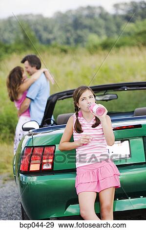Unhappy daughter of affectionate parents View Large Photo Image Stock Photo - Unhappy daughter of affectionate parents. Fotosearch
