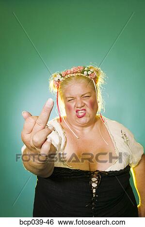 Annoyed woman giving the finger View Large Photo Image Stock Photograph - Annoyed woman giving the finger. Fotosearch