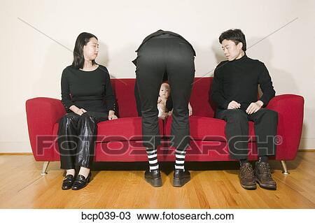 Baby being tended to on couch View Large Photo Image Stock Image - Baby being tended to on couch. Fotosearch