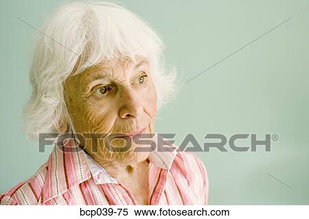 Closeup of a thoughtful senior woman View Large Photo Image Stock Photography - Closeup of a thoughtful senior woman. Fotosearch