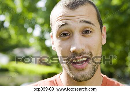 Closeup of young man outdoors View Large Photo Image Stock Photo - Closeup of young man outdoors. Fotosearch