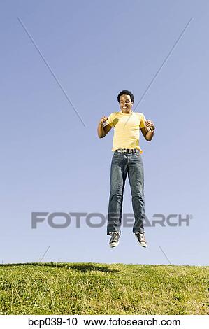 Man jumping in the air View Large Photo Image Stock Image - Man jumping in the air. Fotosearch