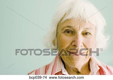 Portrait of a smiling senior woman View Large Photo Image Picture - Portrait of a smiling senior woman. Fotosearch