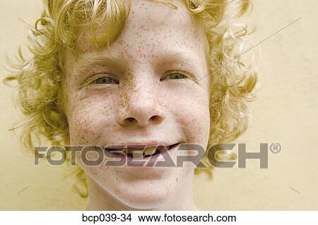 Portrait of a smiling young boy View Large Photo Image Picture - Portrait of a smiling young boy. Fotosearch