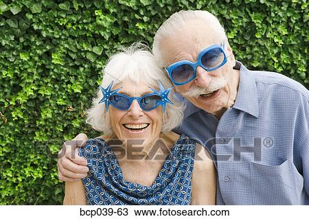 Senior couple in wacky sunglasses View Large Photo Image Stock Image - Senior couple in wacky sunglasses. Fotosearch