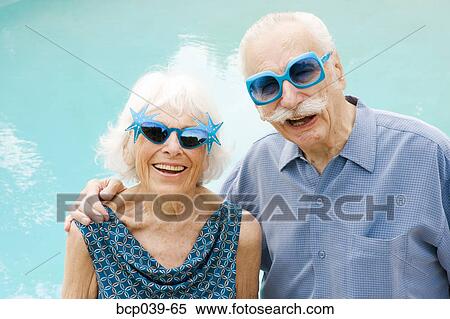 Senior couple in wacky sunglasses View Large Photo Image Stock Photography - Senior couple in wacky sunglasses. Fotosearch