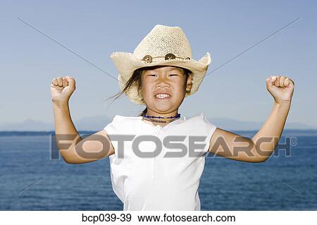 Young girl flexing her muscles View Large Photo Image Stock Photo - Young girl flexing her muscles. Fotosearch