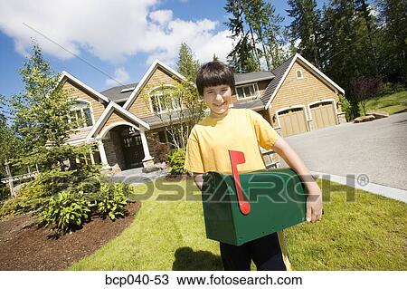 Boy carrying mailbox on front lawn View Large Photo Image Stock Image - Boy carrying mailbox on front lawn. Fotosearch