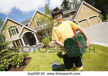Boy with new mailbox outside house View Large Photo Image Stock Photography - Boy with new mailbox outside house. Fotosearch