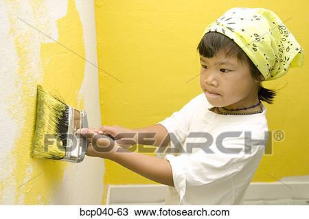 Child concentrating on painting wall View Large Photo Image Stock Image - Child concentrating on painting wall. Fotosearch