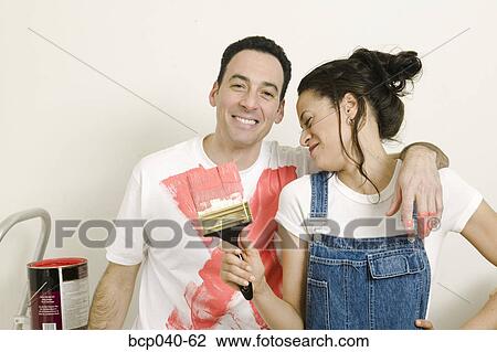 Couple having playful paint fight View Large Photo Image Stock Image - Couple having playful paint fight. Fotosearch