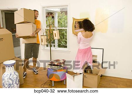 Couple moving into new home View Large Photo Image Stock Image - Couple moving into new home. Fotosearch