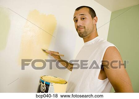 Man choosing wall paint View Large Photo Image Stock Photo - Man choosing wall paint. Fotosearch