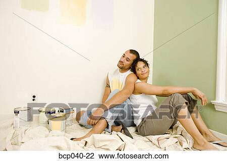 Tired couple with painting supplies View Large Photo Image Stock Image - Tired couple with painting supplies. Fotosearch