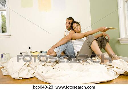 Tired couple with painting supplies View Large Photo Image Stock Image - Tired couple with painting supplies. Fotosearch