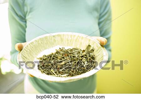 Woman holding pan of rusty screws View Large Photo Image Stock Image - Woman holding pan of rusty screws. Fotosearch