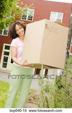 Woman posing with big moving box View Large Photo Image Stock Photography - Woman posing with big moving box. Fotosearch