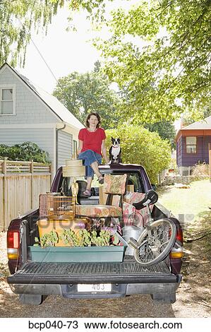 Woman with loaded pickup and dog View Large Photo Image Stock Image - Woman with loaded pickup and dog. Fotosearch