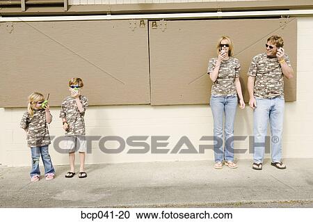 Family in camouflage playing with radios View Large Photo Image Stock Image - Family in camouflage playing with radios. Fotosearch