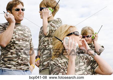 Family in camouflage with walkie-talkies View Large Photo Image Stock Photo - Family in camouflage with walkie-talkies. Fotosearch