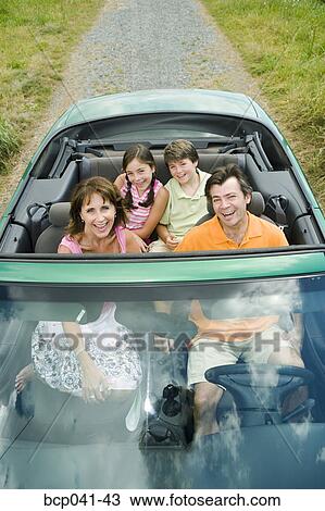 Family in convertible with top down View Large Photo Image Stock Image - Family in convertible with top down. Fotosearch