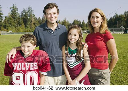 Football player and cheerleader with parents View Large Photo Image Stock Image - Football player and cheerleader with parents. Fotosearch