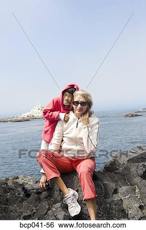 Grandmother and granddaughter posing seaside View Large Photo Image Stock Photograph - Grandmother and granddaughter posing seaside. Fotosearch