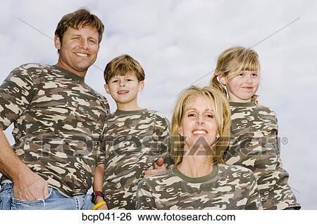 Stock Photograph - Portrait of family in camouflage shirts. Fotosearch