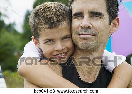 Portrait of father and young boy View Large Photo Image Stock Image - Portrait of father and young boy. Fotosearch