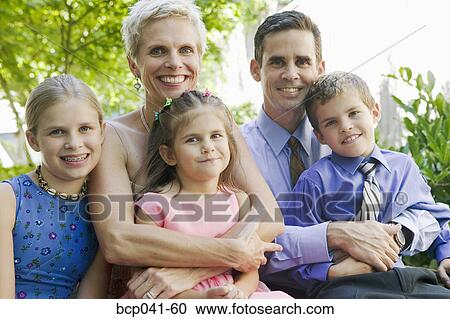 Stock Image - Portrait of parents and three children. Fotosearch