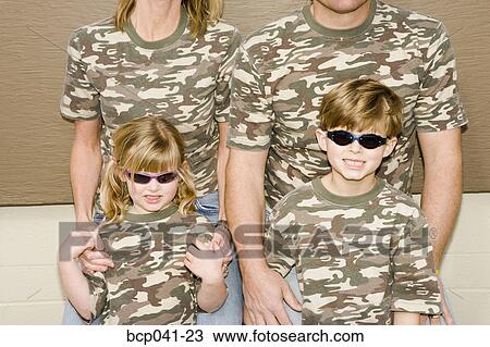 Young children with parents in camouflage View Large Photo Image Stock Image - Young children with parents in camouflage. Fotosearch