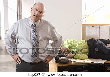 Boss Discovering Employee Asleep On Desk Picture Bcp037 24