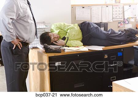 Boss Discovering Employee Asleep On Desk Stock Image Bcp037 21
