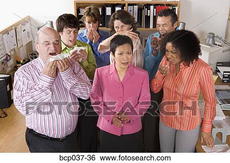 Stock Photograph - Co-workers with colds. Fotosearch