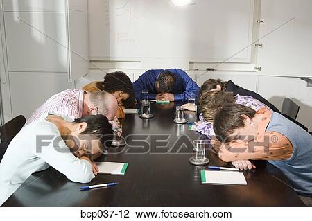 Colleagues asleep at conference table View Large Photo Image Stock Image - Colleagues asleep at conference table. Fotosearch
