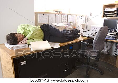 Male Office Worker Asleep On Desk Stock Image Bcp037 13 Fotosearch