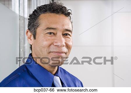 Stock Photograph - Portrait of a male executive. Fotosearch