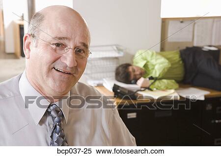 Portrait of boss with sleeping employee View Large Photo Image Stock Photography - Portrait of boss with sleeping employee. Fotosearch