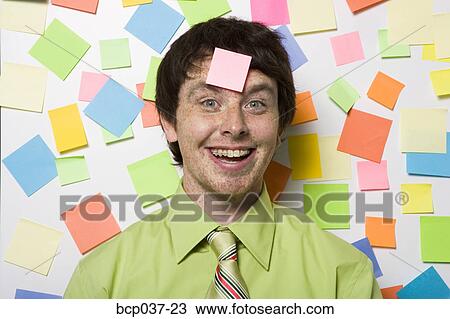 Portrait of office worker with sticky notes View Large Photo Image Stock Image - Portrait of office worker with sticky notes. Fotosearch
