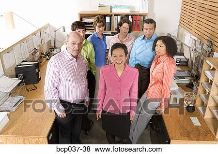 Portrait of smiling boss and unhappy staff View Large Photo Image Stock Photo - Portrait of smiling boss and unhappy staff. Fotosearch