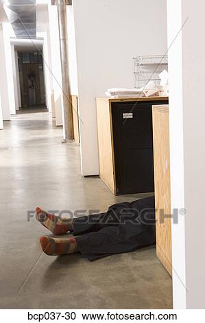 Prone body of a male office worker View Large Photo Image Stock Image - Prone body of a male office worker. Fotosearch