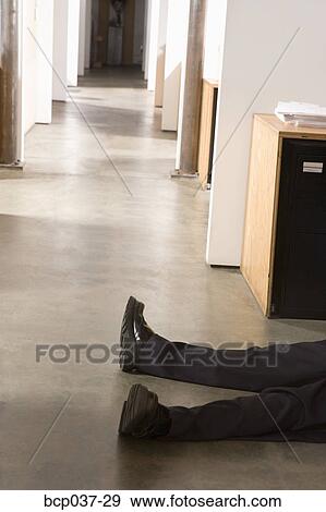 Prone body of a male office worker View Large Photo Image Stock Photo - Prone body of a male office worker. Fotosearch