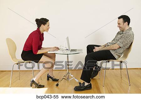 Man and woman working with laptops View Large Photo Image Stock Photography - Man and woman working with laptops. Fotosearch