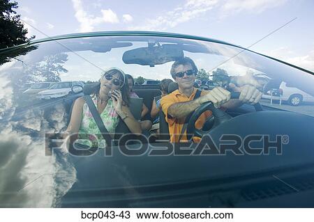 Parents and kids in convertible View Large Photo Image Stock Image - Parents and kids in convertible. Fotosearch