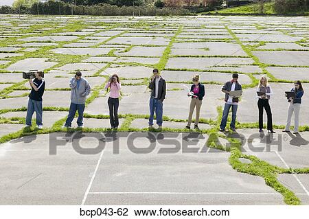 Teenagers using electronic gadgets View Large Photo Image Stock Image - Teenagers using electronic gadgets. Fotosearch